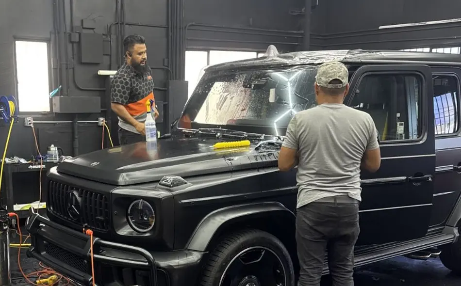 LUXE Windshield Guard being applied to a Mercedes-AMG G63 windshield by SFS Bay Area installers