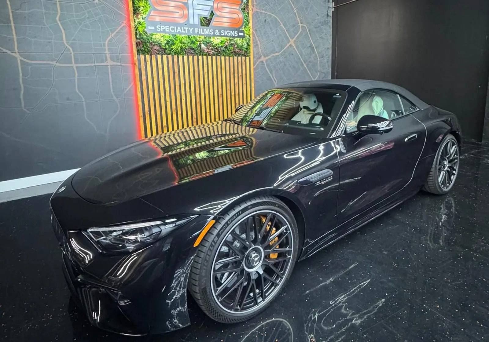 Black Mercedes-AMG SL protected with LUXE Gloss Is Boss paint protection film, photographed in the SFS Bay Area showroom in San Jose